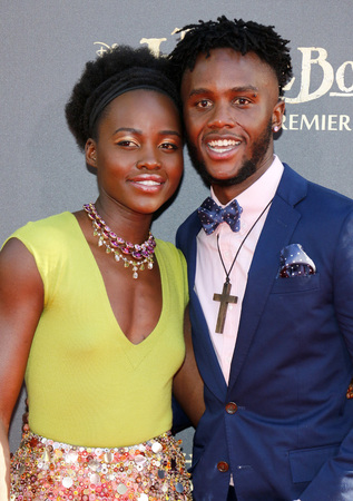 54681932 - lupita nyong'o and peter nyong'o at the world premiere of 'the jungle book' held at the el capitan theatre in hollywood, usa on april 4, 2016.