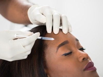MelanMag - FaceValue - 55666735 - close-up of young woman having cosmetic treatment at beauty clinic