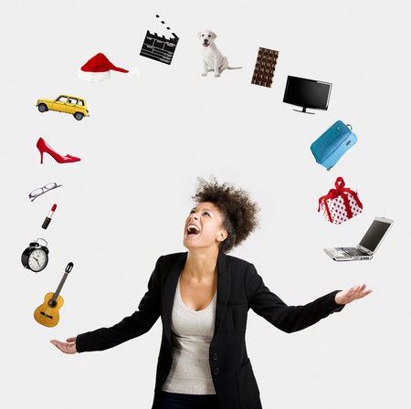 The five skills of a winning solopreneur - 37409745 - a beautiful afro-american woman juggling multiple objects over the air
