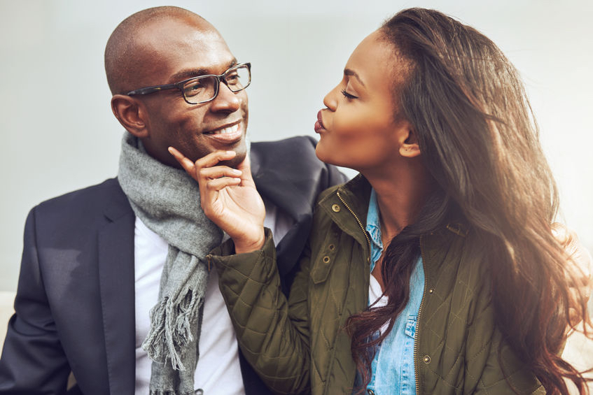 47837288 - coquettish young african american woman on a date with a handsome man playfully puckering up her lips for a kiss Is the idea of a perfect marriage just a myth?