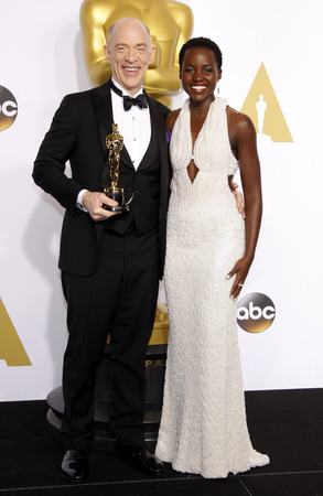 56092504 - lupita nyong'o and j.k. simmons at the 87th annual academy awards - press room held at the loews hollywood hotel in hollywood, usa on february 22, 2015.