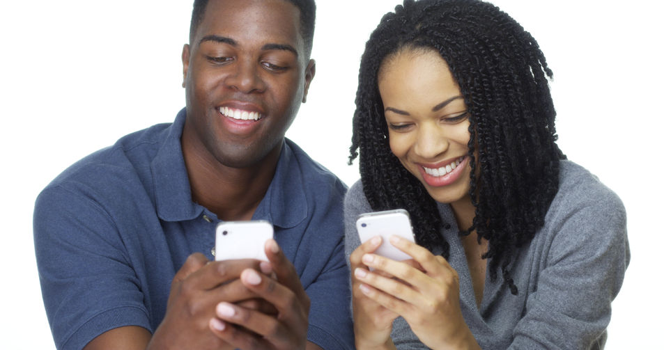 dating app - 101 ways to meet your lover, and the dating app isn’t one! 33803256 - young african american couple texting on cell phones together