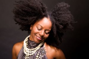 Hair inspo: 10 protective styles on YouTube 74899737 - african american woman laughing and dancing.