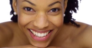 How to design a skincare regimen 33804572 - sweet african woman showing off her pearly whites
