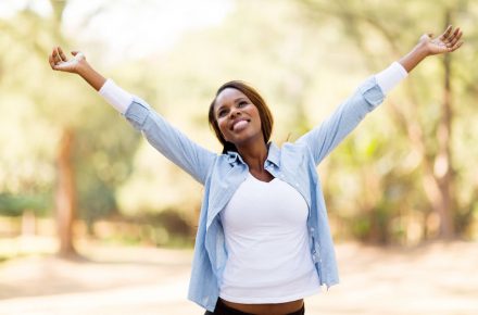 30685346 - happy african woman with arms outstretched outdoors How to silence that negative voice in your head!