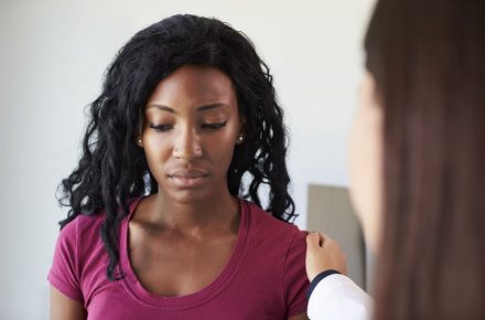 71353026 - doctor talking to unhappy female patient in exam room It’s Ovarian Cancer Awareness Month – here’s what you need to know