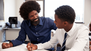 Black teacher and pupil with Afro hair