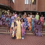 Queen Ronke Ademiluyi-Ogunwusi outside Kensington Town Hall with models featuring Adire textiles