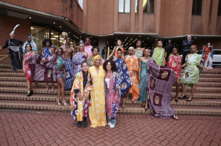 Queen Ronke Ademiluyi-Ogunwusi outside Kensington Town Hall with models featuring Adire textiles