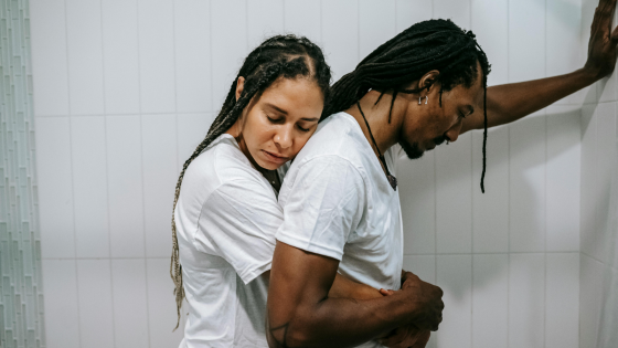 A woman and a man hugging